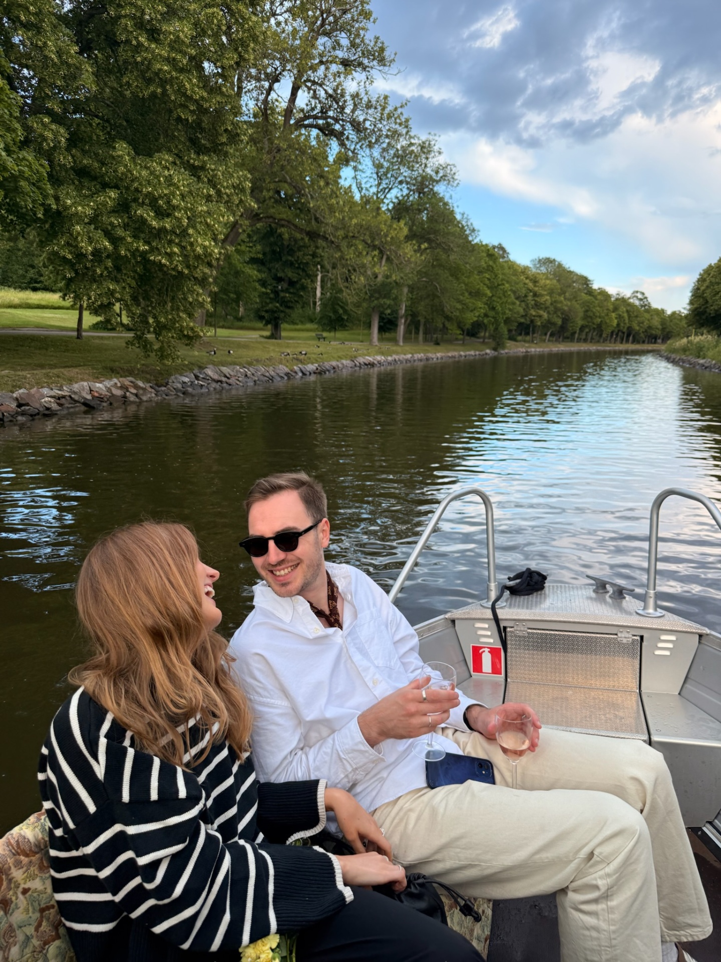 Couple laughing on the boat along Djurgårdskanalen